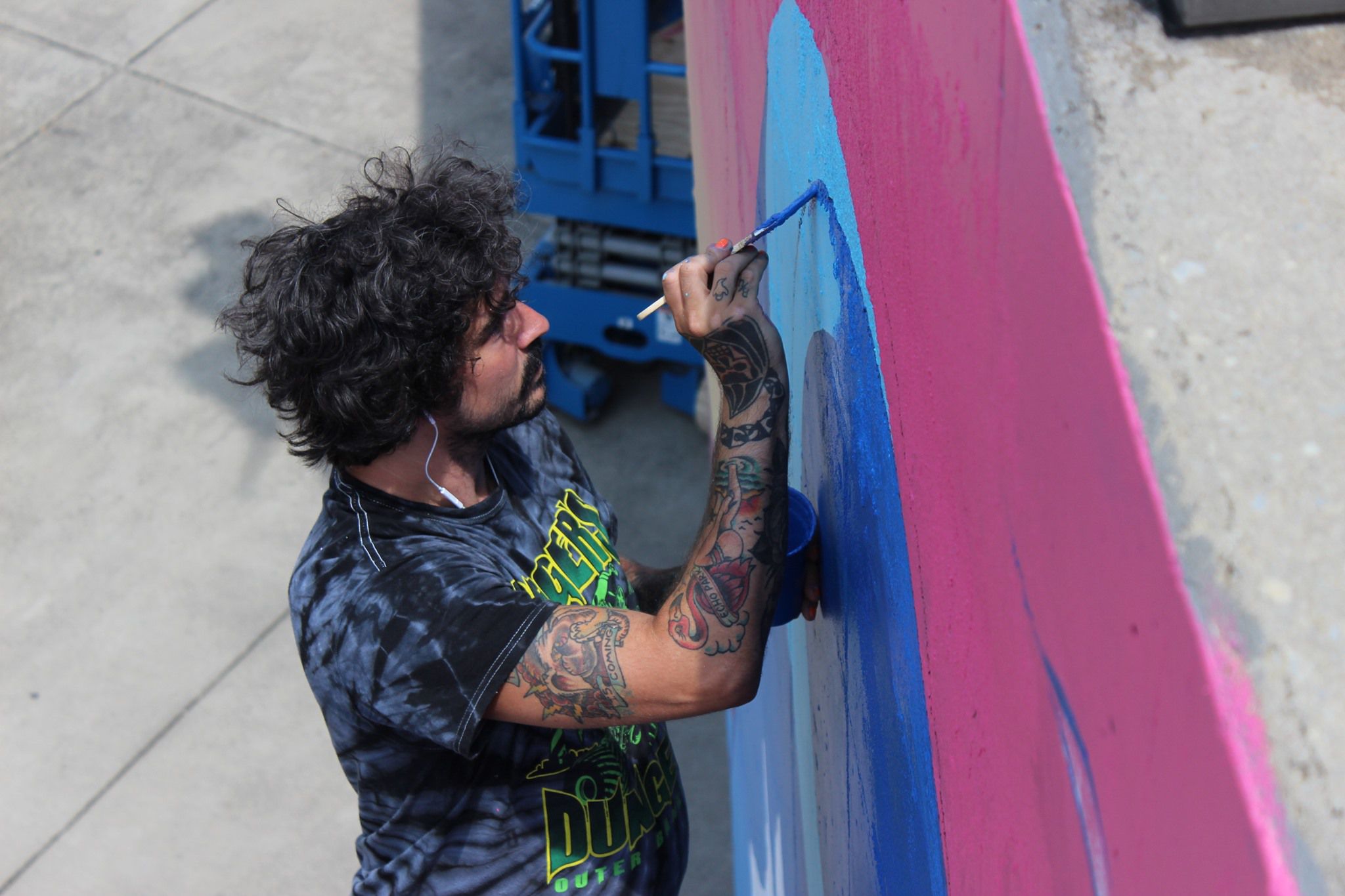 Photo of the artist working on the exhibit