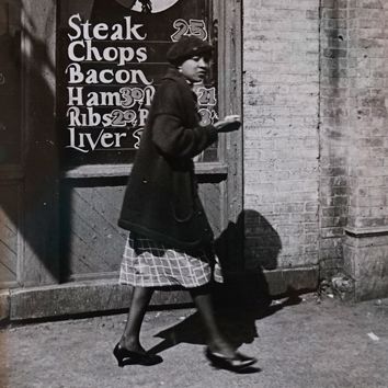 Peter Sekaer (1901-1950), Untitled (Woman Walking Past Butcher Shop) (detail), c. 1939, Gelatin silver print, Collection of Walter and Sally Rugaber
