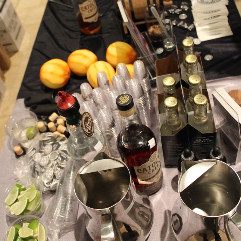 bottles, glasses, and fruit on a table