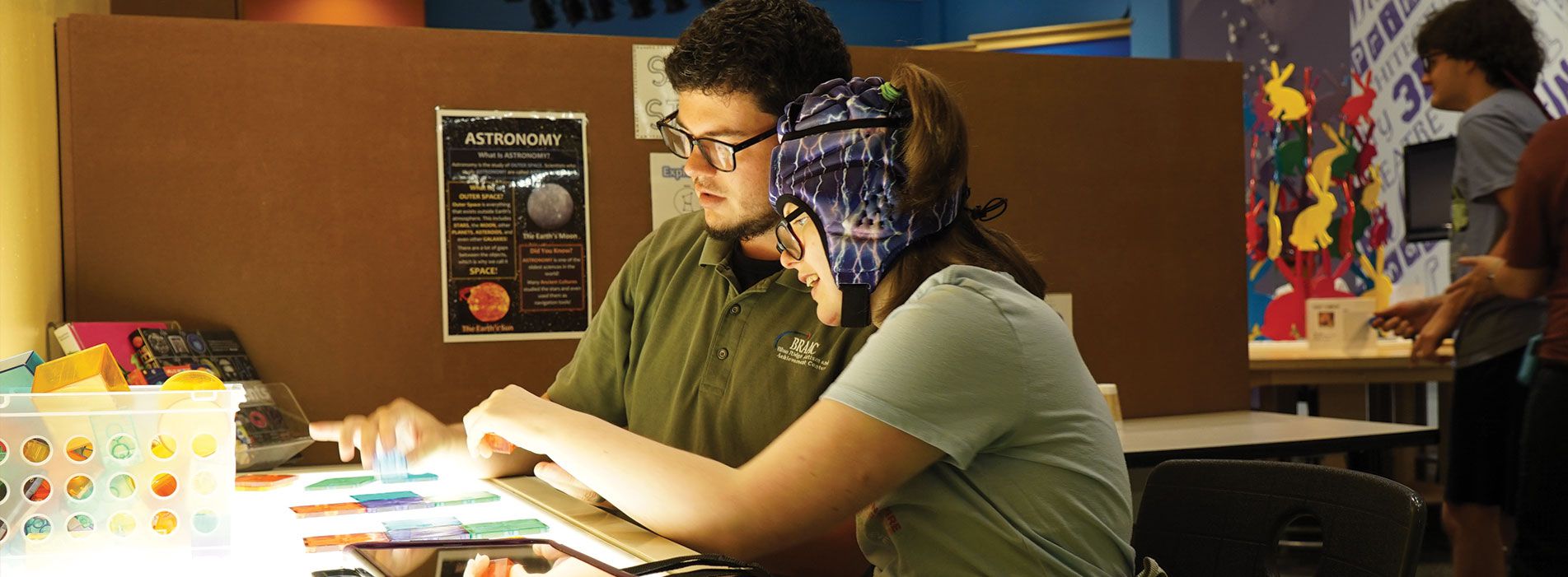 2 people using accessibility tools at Taubman