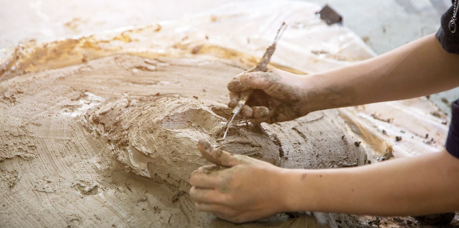 Person Sculpting With Clay