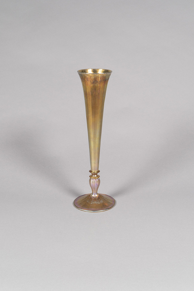 Louis Comfort Tiffany (American, 1848-1933), Footed Vase, ca. 1910, Favrile glass, 14 x 4 ½ inches, Collection of the Taubman Museum of Art, Gift in Memory of Madge P. Murray by Dr. and Mrs. Robert L. Murray, 1984.011