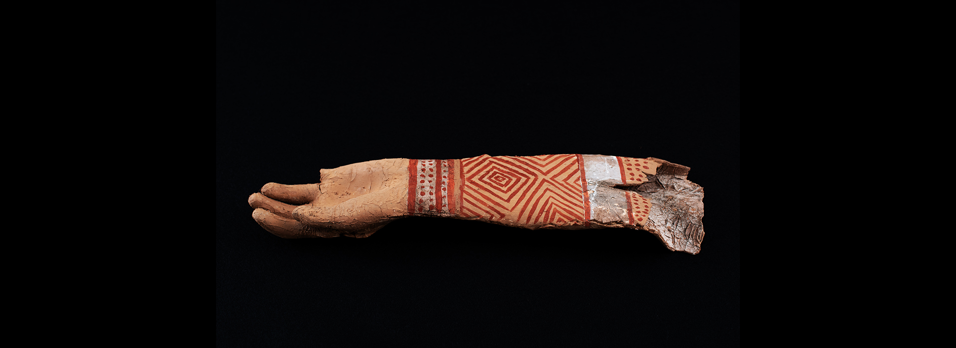 Ceramic tattooed arm made to look like an artifact