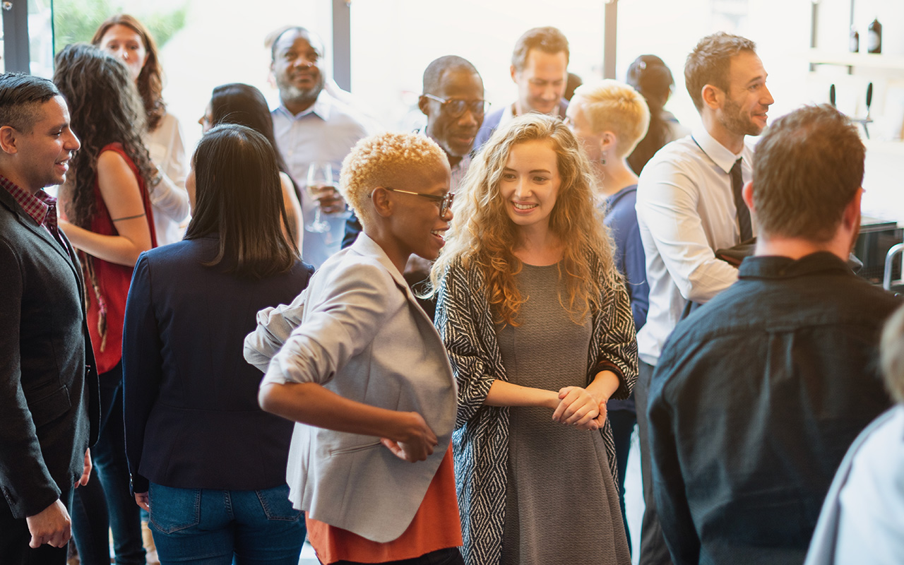 co-ed young professional group socializing