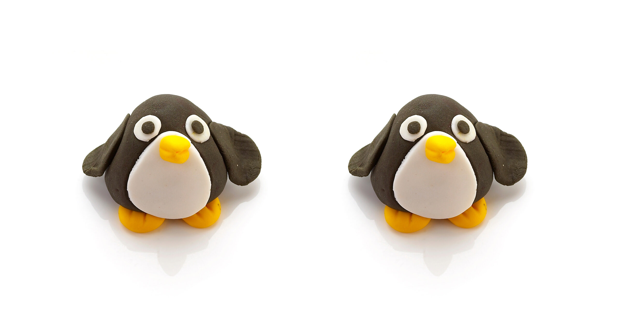 Two penguin figures made of clay