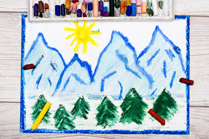 A child's drawing of blue mountains with a yellow sun and green trees in the foreground