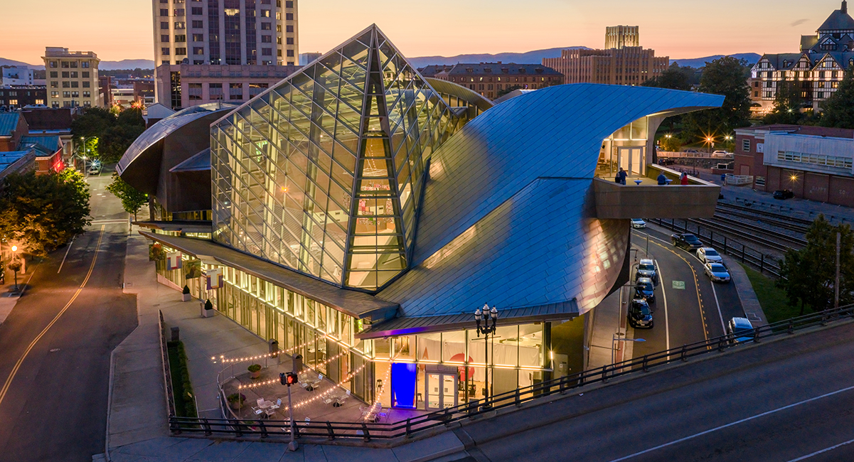 An aerial shot of the Taubman Museum of Art in downtown Roanoke at dusk