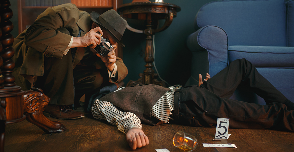 A detective takes a picture of a body laying on a floor with an overturned glass next to the person's hand